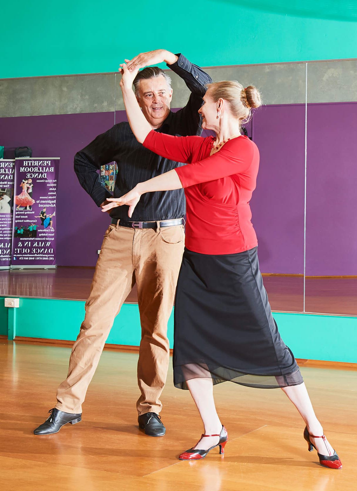 two older adults dancing
