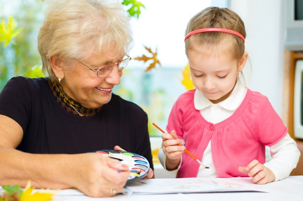 grandmother and child doing crafts