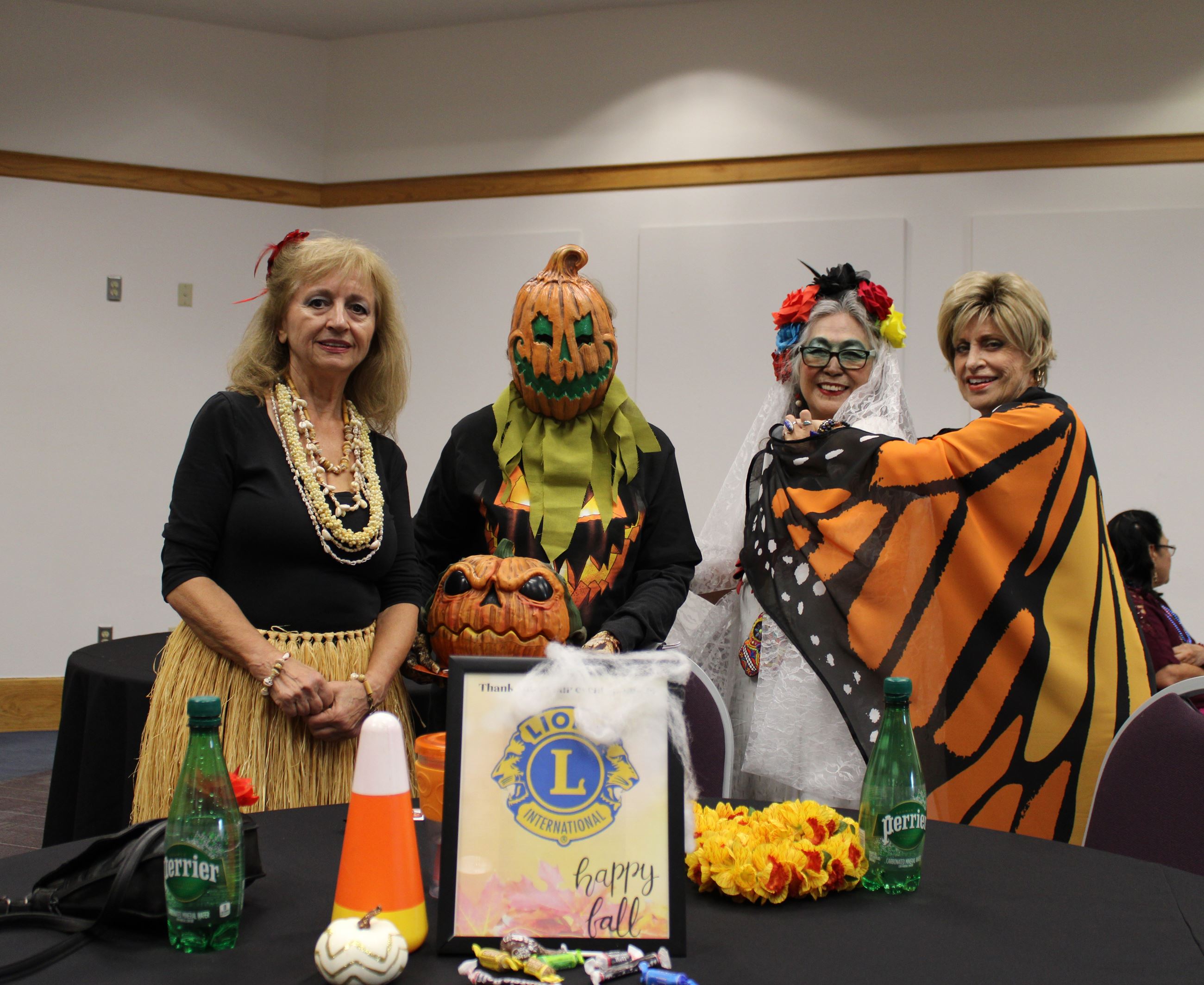 4 seniors wearing Halloween costumes