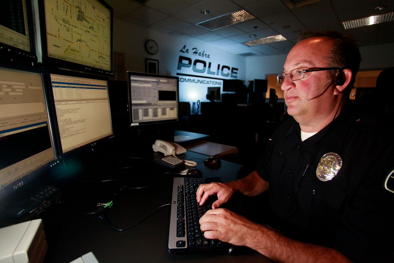 Dispatcher working on the phone and computer